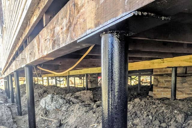 Quality Foundation Repair Austin Adjust-A-Piers stabilizing a crawl space and its floor above.