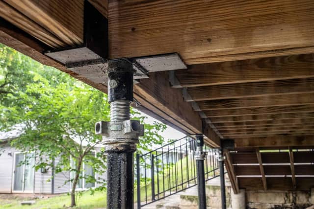 Quality Foundation Repair Austin Adjust-A-Pier stabilizing a crawl space beneath a deck.