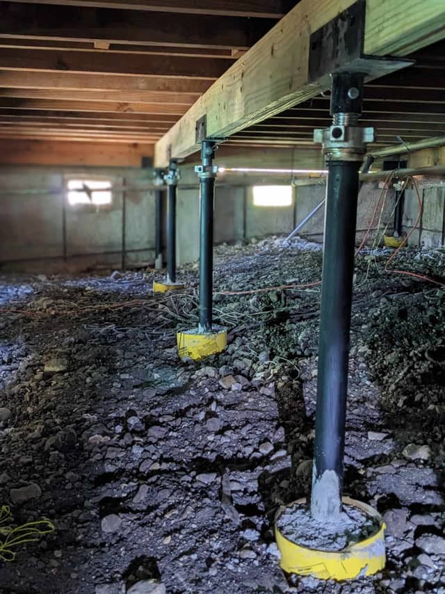 Quality Foundation Repair Austin Adjust-A-Piers supporting sagging floors in a crawl space.
