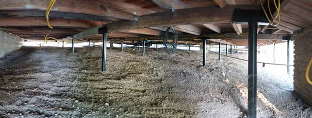 Quality Foundation Repair Austin Adjust-A-Piers supporting sagging floor joists in a crawl space.